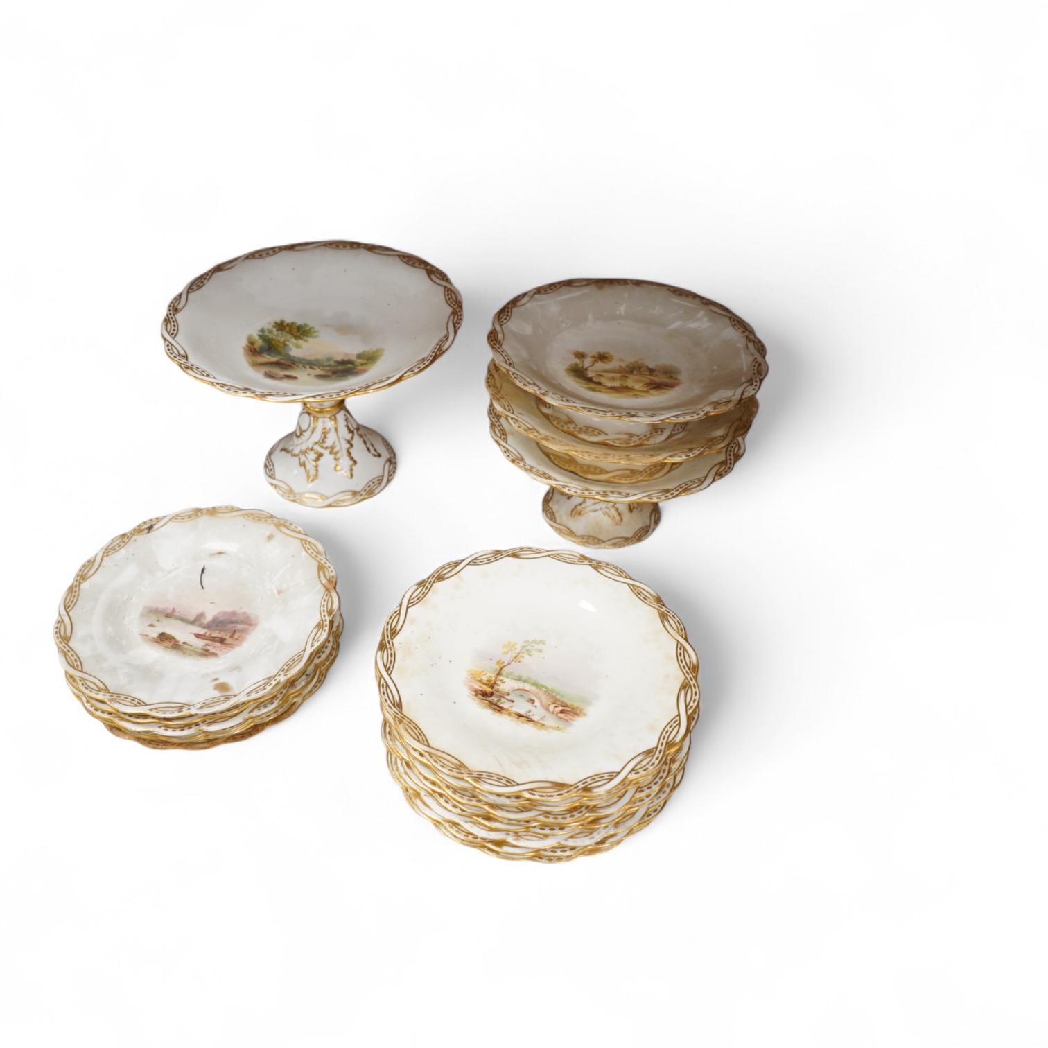 A Late 19th century Minton porcelain part dessert service, each piece painted with differing landscapes, largest 28cm in diameter